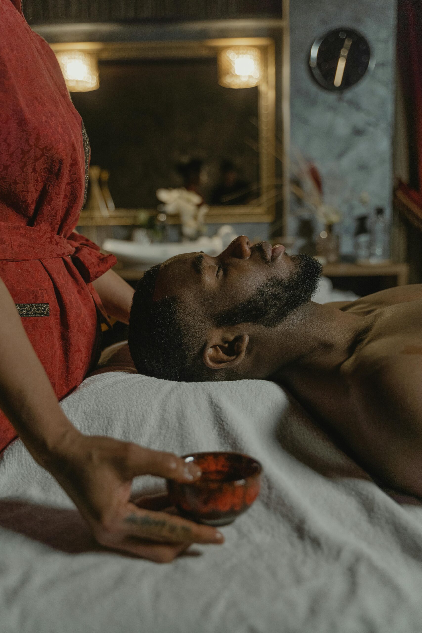 A man receiving a relaxing massage at a spa, promoting wellness and relaxation.